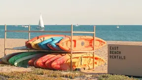 Hot Asian beauty wanks her smooth pussy outside