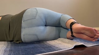 Tied up girl can’t hold it anymore pees in light jeans