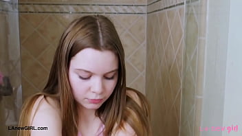 Cute teen model enjoys a sensual bath