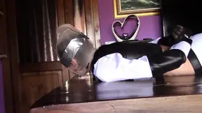 She's hogtied on a table, nylon hooded, roughly throated for ten minutes with massive cum swallow