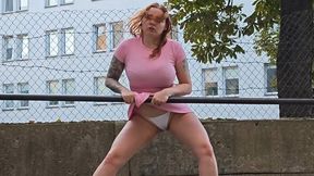 A young busty milf can't stand it and pees in public, then takes off her clothes and dances on a carpet beater.