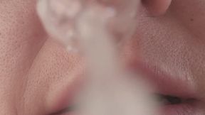 Extremely wet and messy POV blowing yellow snot onto the camera lens