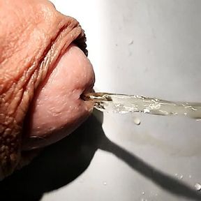 Slow motion piss from big penis