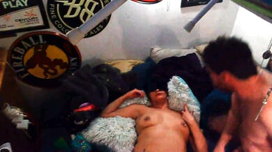 Black-haired beauty and bearded man heat up in a dim bedroom
