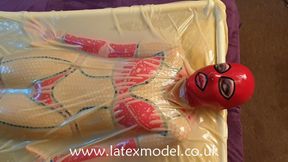 Enjoying the feel of being covered by latex