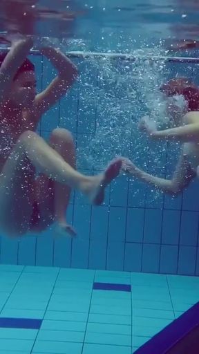 Blonde and Brunette babes swim naked   Clip 1