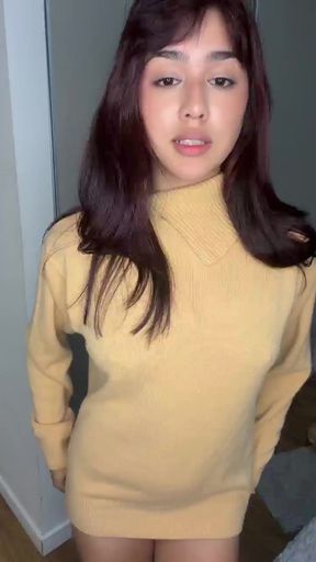 Young woman in yellow turtleneck