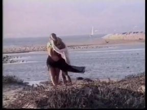 Blonde lesbians lovers lick each other on the sandy beach - Vintage video- No audio,but music