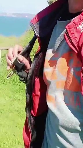Sexy Guy on the Beach Clearing a Little