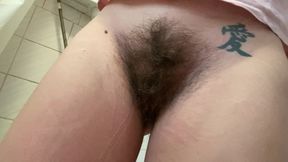 Pissing on the toilet hairy girl