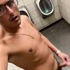 German twink masturbates naked on the toilet at the highway rest stop