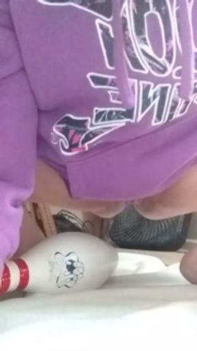 Slut bounces on bowling pin
