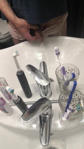 Pissing nicely in the sink...
