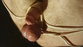 Miss M edging handjob on a helpless naked man tied with legs in the air