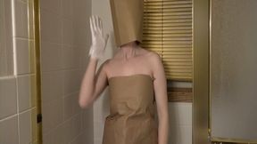 Paper bags and knee high socks in the shower getting wet