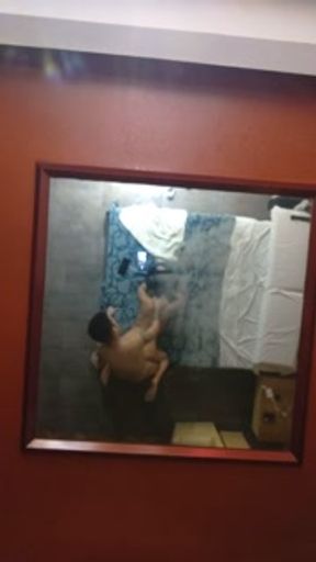 with a brunette in an Argentine hotel