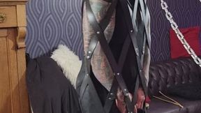 Hubby restrained in a leather cage