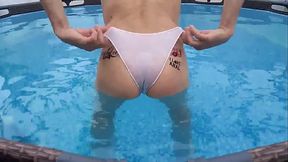 Slut in white panties having fun in the pool