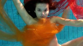 Sweet and naughty European teen spinner under water