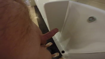 Peeing naked at a public urinal