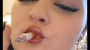 Slow chain smoking with glossy lips