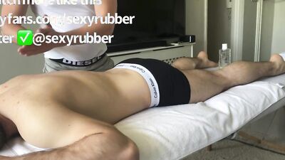 Gay masseur fingers and jerks his customer off while sitting on his face