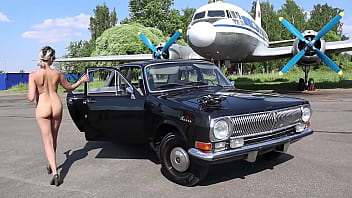 Soviet plane, black Volga and nude model