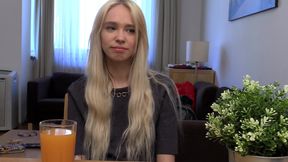 Blonde Babe Grips Purple Vibrator with Naughty Smile