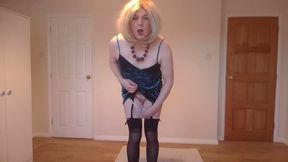 Stripping out of my blue party dress with black stockings and suspender belt
