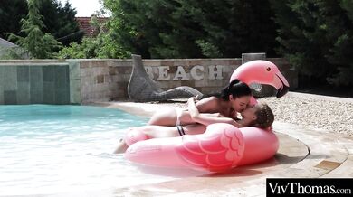 Gorgeous lesbian has fun in the pool making her lover cum
