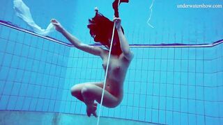 Alla Birtakik undresses naked into the swimming pool