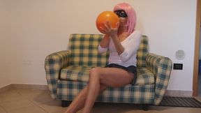 Sit to pop big orange balloon