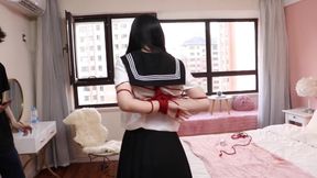 Gg50 - Cute Girl Challenges Herself to Break Free From the Restraints of Ropes and a Single Glove on the Bed.