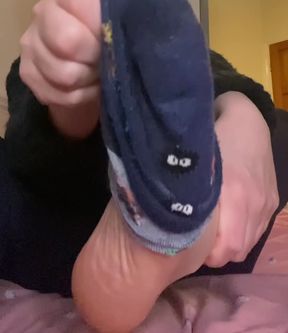 Smelling sweaty feet after a long day at work