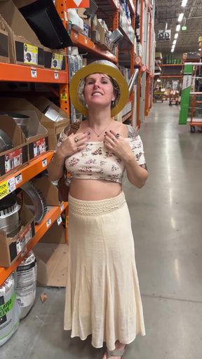 Woman in costume standing in a hardware store