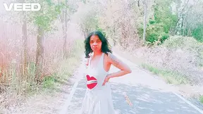 Solo female in skirt teases on the beach