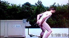 Crossdresser Riding a Giant Dildo on a Roof Top