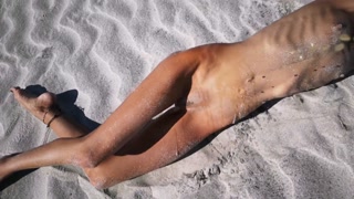 Stranger finds a perfect tanned skinny brunette on a nudist beach and gives her a hot piss