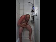 Nick Zwei intimate shaves himself as he washes himself in the shower