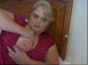 Bosomy blond mom mauls her huge jugs while flirting through webcam