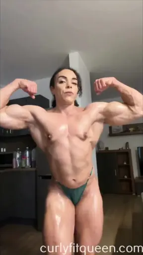 Naked muscle milf showing off her flexed muscles