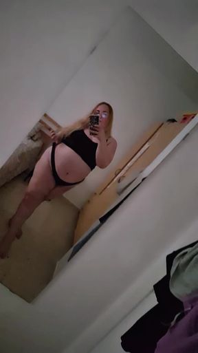 Pregnant woman in black bikini