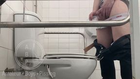 in the hospital toilets, a guy pisses into a cup for a urine sample, then gets horny, jerks-off and cums
