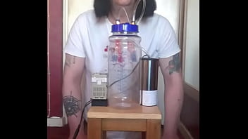 bisexual crossdresser with his portable cow milking machine