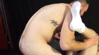 Bald and bearded guy rims his partner and rails him