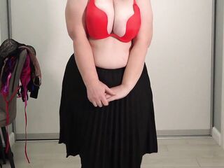 Older teacher chooses a brassiere for work. Large pretty melons jump and pop without bras. Saggy bazookas.