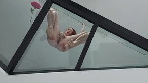 perverted woman squirting on top of a glass floor