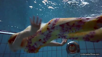 Sexiest brunette teen Milana Voda swimming in pool