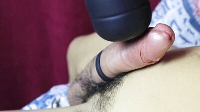 very powerful vibrator and lubricant flow over the cock close up