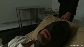 ”Tranny scientist fucks man in gimp mask”